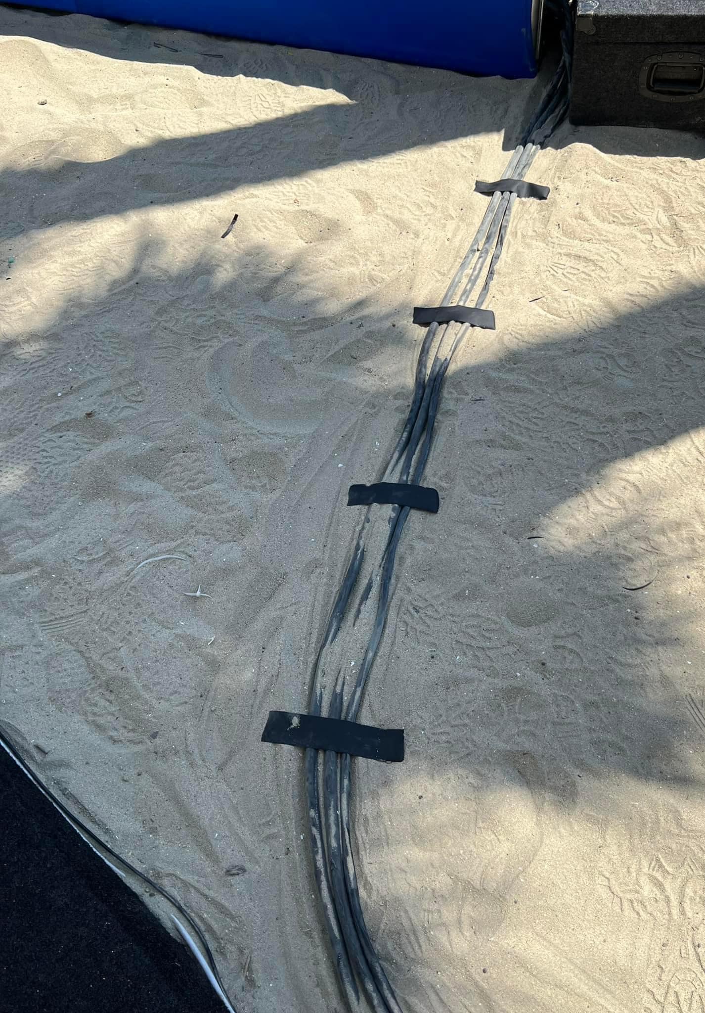 The meme is an image of a long, thin, dark line running through the sand, with several small black rectangles attached to it. The line is labeled "Terrorist Tunnel" and has a caption that says "Just found the one we've been searching for". The image is likely a humorous exaggeration of the idea that a small, hidden tunnel is a significant threat.